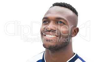 Happy football player in blue jersey