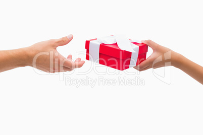 Woman passing man a gift
