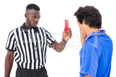 Referee sending off football player