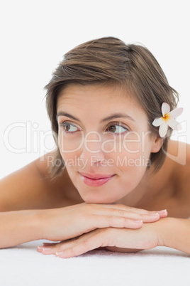 Close up portrait of a beautiful young woman on massage table