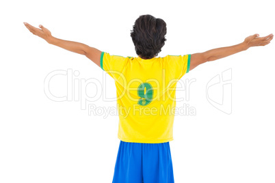 Football player in yellow celebrating a victory