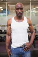 Serious muscular man in gym