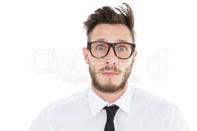 Geeky young businessman looking at camera