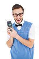 Geeky hipster holding a retro cellphone