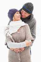 Happy mature couple in winter clothes embracing