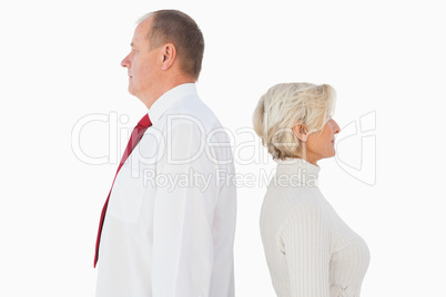 Older couple standing not facing each other