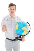 Geeky hipster holding a globe