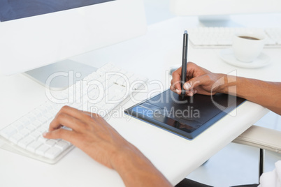 Designer working at desk using digitizer