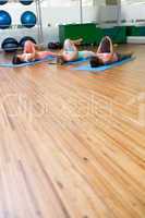 Yoga class stretching in fitness studio