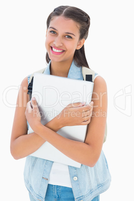 Pretty student holding her laptop