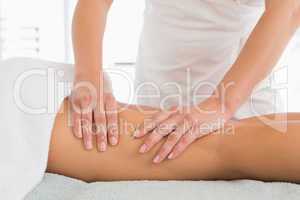 Close-up of a woman receiving leg massage