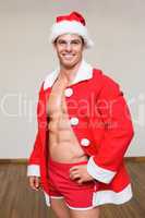 Macho man in santa costume at the gym