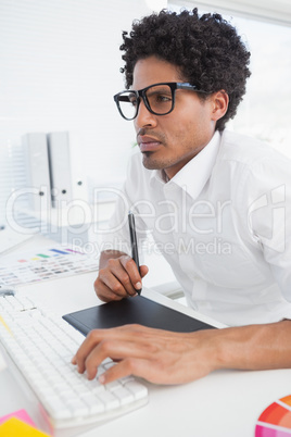 Hipster designer working at his desk