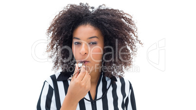 Pretty referee blowing her whistle