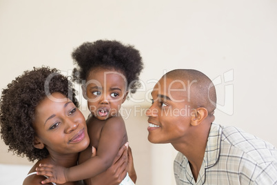 Happy parents with baby girl