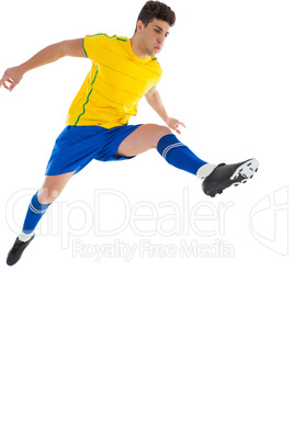 Football player in yellow jumping