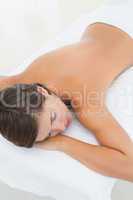 Beautiful woman lying on massage table