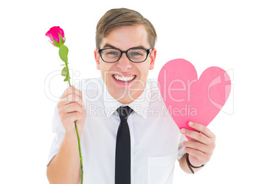 Geeky hipster holding a red rose and heart card