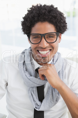 Hipster businessman smiling at camera