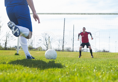 Goalkeeper in red ready to save a penalty