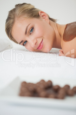 Beautiful blonde enjoying a chocolate beauty treatment