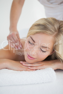 Pretty blonde enjoying a massage