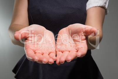 Businesswoman presenting your product with hands