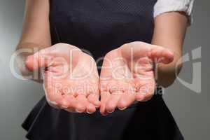 Businesswoman presenting your product with hands