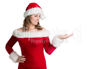 Pretty woman in santa costume presenting your product