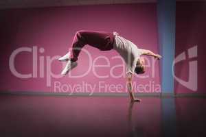 Cool break dancer doing handstand on one hand