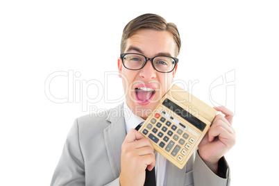 Geeky smiling businessman showing calculator