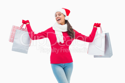 Beautiful festive woman holding shopping bags