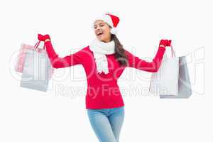 Beautiful festive woman holding shopping bags