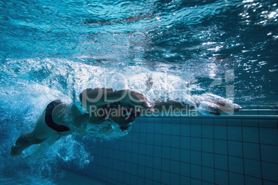 Fit swimmer training by himself