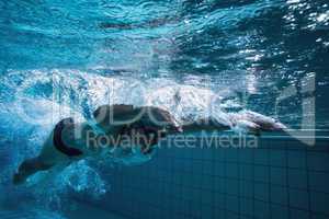 Fit swimmer training by himself