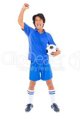 Football player in blue celebrating a victory