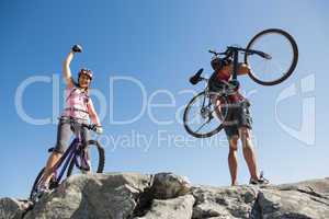 Fit cyclist couple at the summit