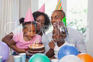 Happy family celebrating a birthday together