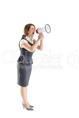 Young businesswoman shouting into bullhorn