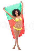 Girl in yellow bikini holding up portugal flag smiling at camera