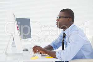 Focused businessman sitting at his desk working