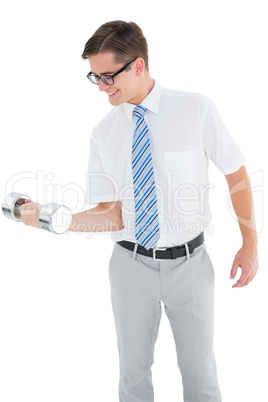 Geeky happy businessman lifting dumbbell