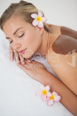 Beautiful blonde enjoying a chocolate beauty treatment