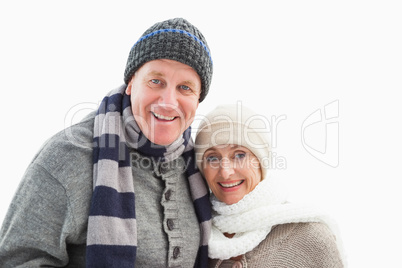 Mature couple in winter clothes smiling at camera Mature couple in winter clothes smiling at camera