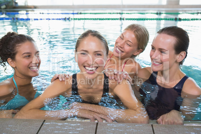 Female fitness class smiling at camera