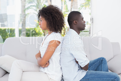 Attractive couple not talking on the couch