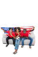 American football fans in red on the sofa