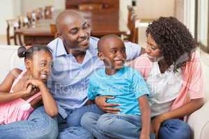 Family relaxing together on the sofa