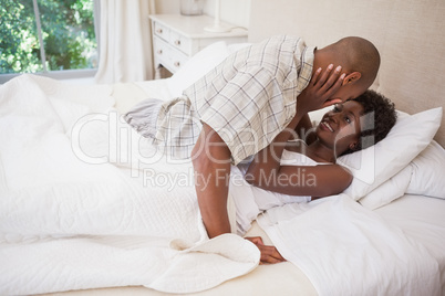 Happy couple in bed together