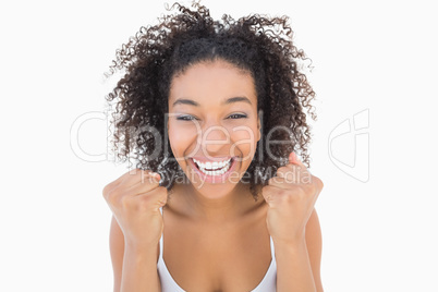 Pretty girl with afro hairstyle smiling at camera